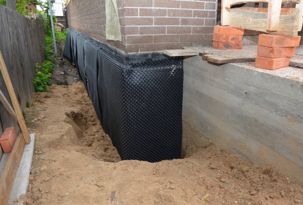 Happy homeowners after waterproofing job in Poynette